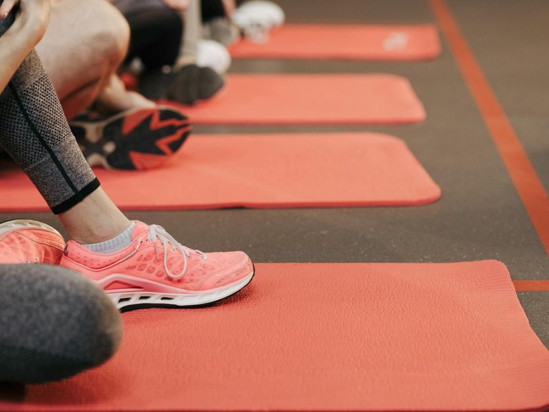Close-up of athletic shoes hitting the floor during a workout session