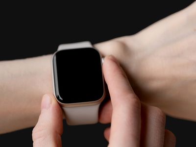 Hands adjusting a smart watch before starting a session