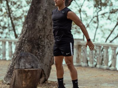 Person jumping in mid-air during a high-energy cardio workout