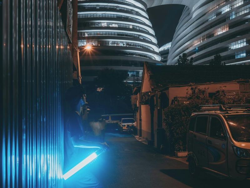 Spacious minimalist training area with atmospheric neon blue lighting